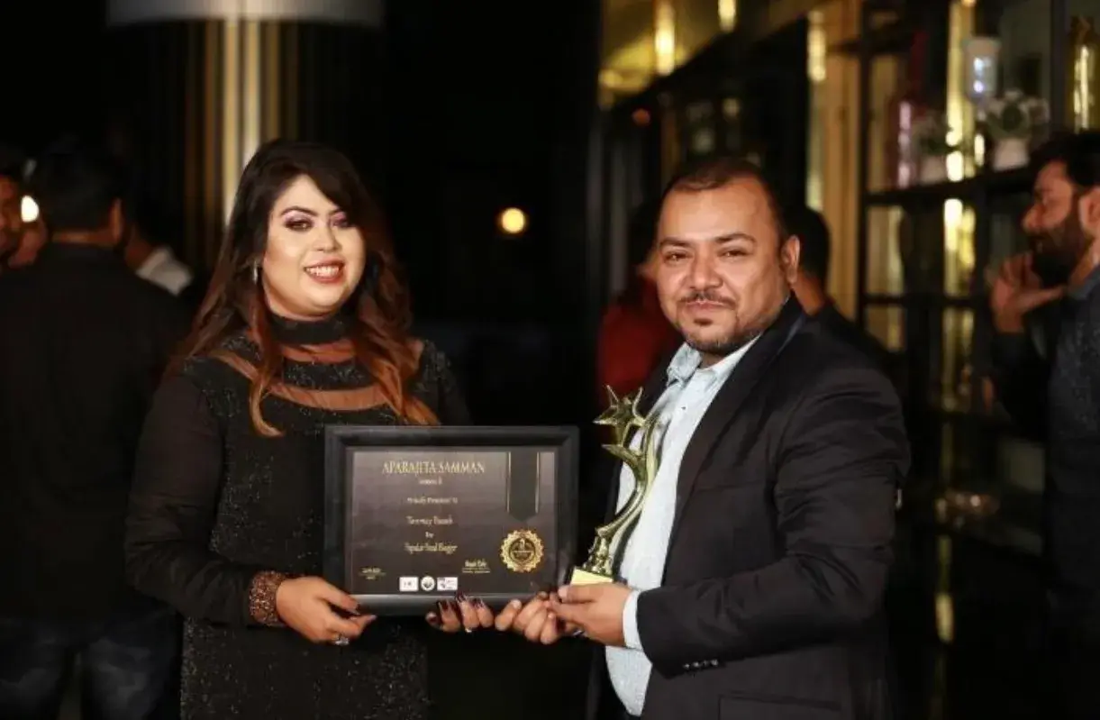 Receiving an award at an industry ceremony.