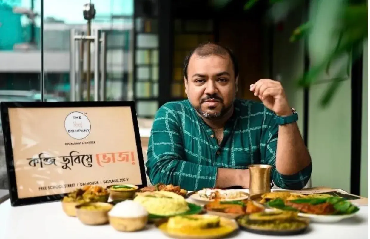 Presenting a Bengali menu at a restaurant launch.