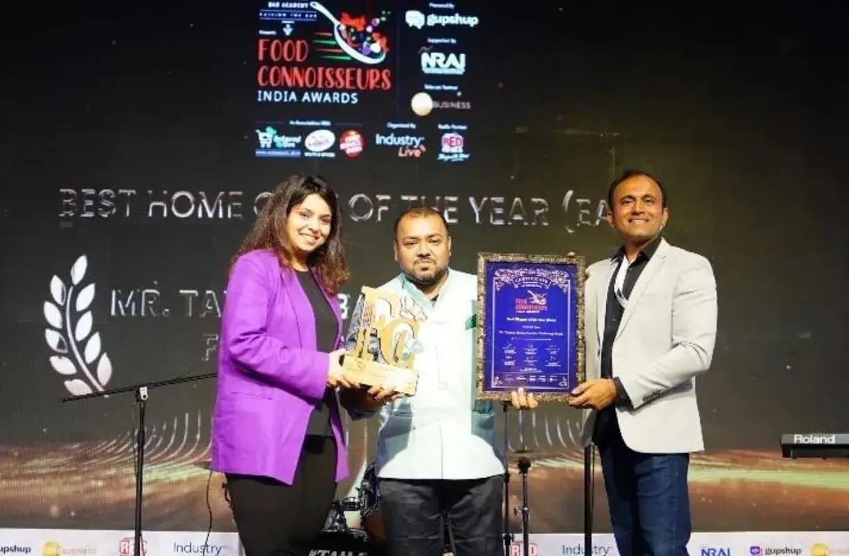 Receiving a Food Connoisseurs India award.