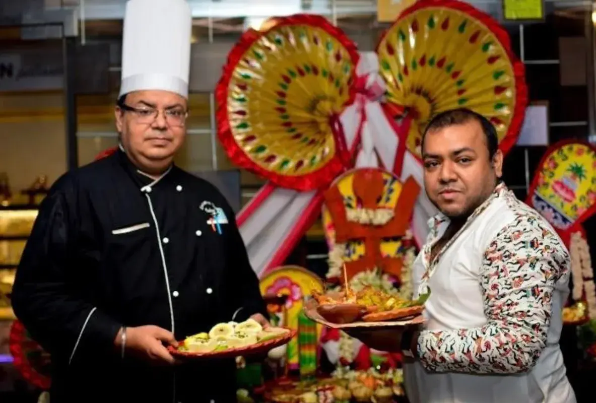A festive menu presentation with the kitchen team.