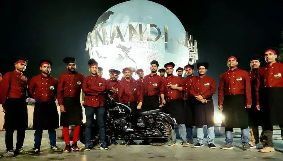 The team in maroon uniform gathered at the venue entrance before service.