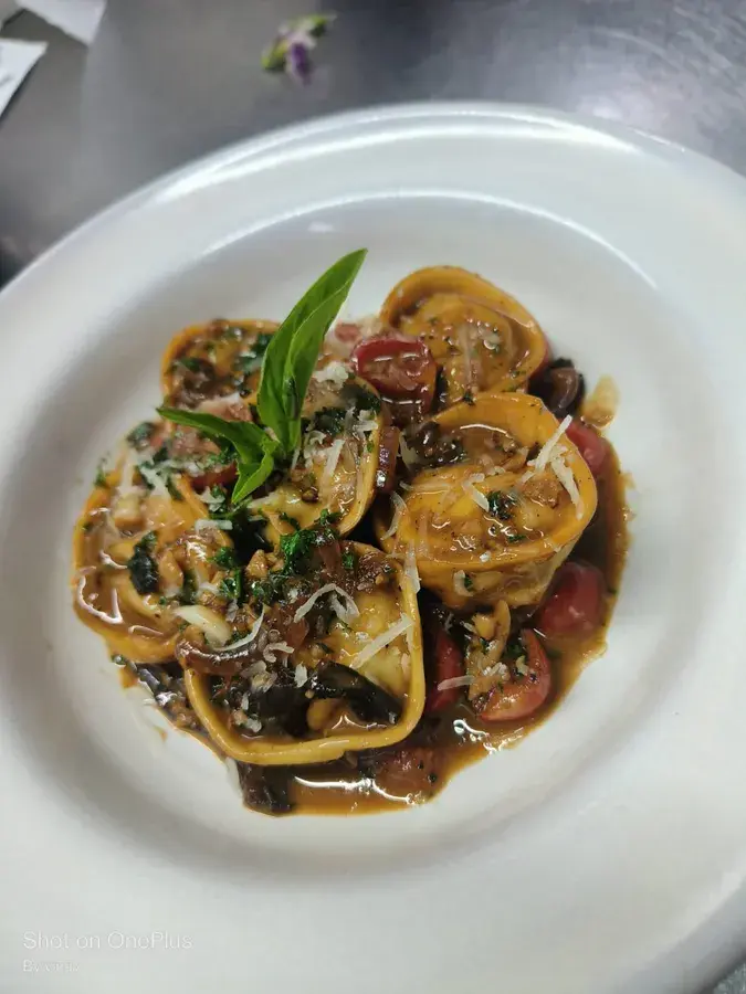 Ravioli finished in a mushroom sauce.