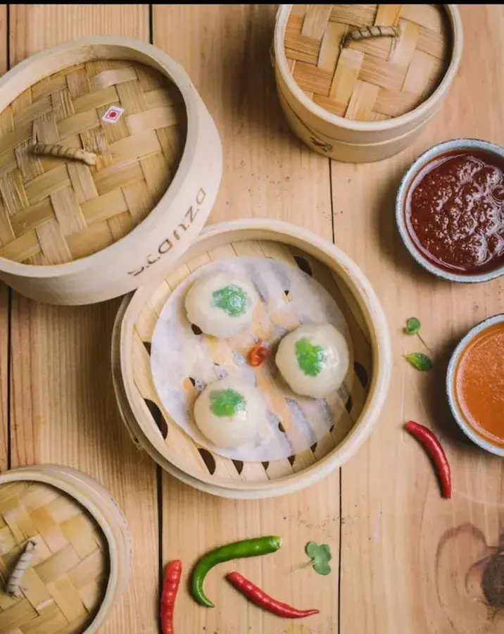 Steamed dim sum in bamboo baskets.