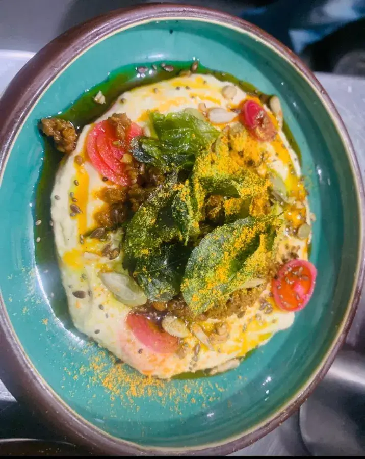 A plated dish served on a turquoise plate.