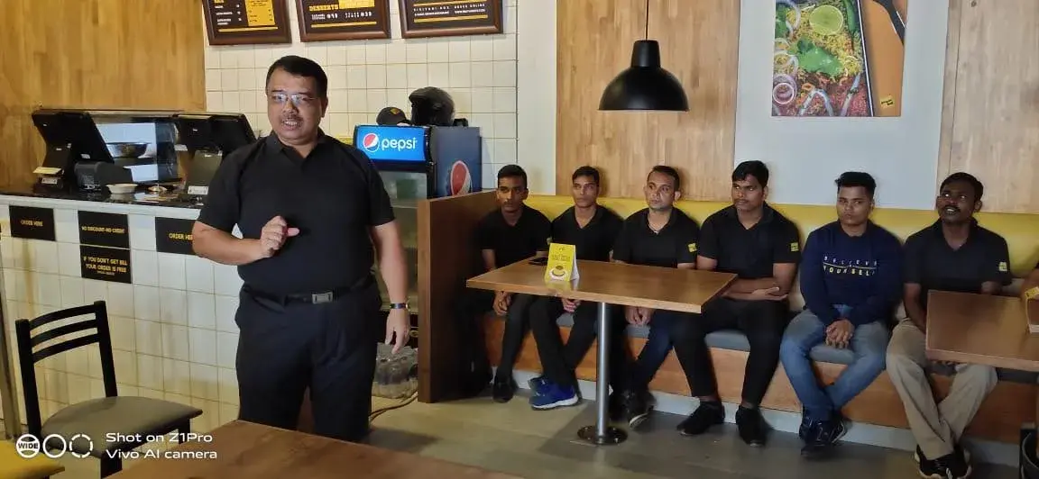 The team seated together at a client site.
