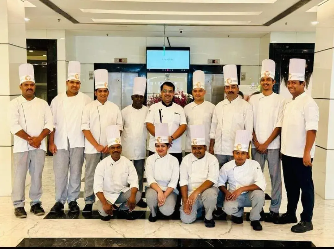 A chef brigade in full uniform.
