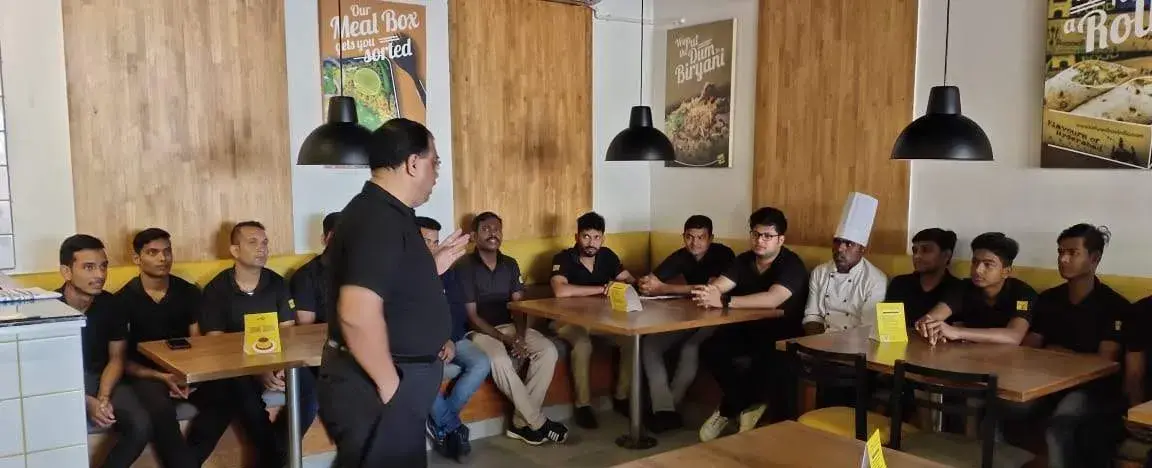 A staff briefing in progress before service.