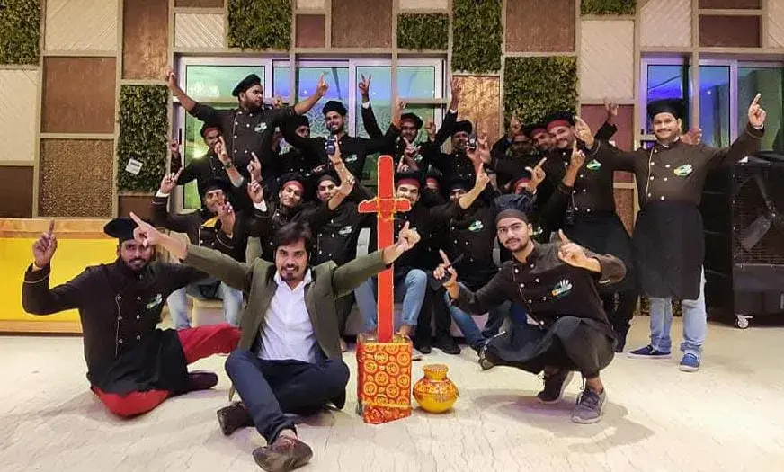 The team celebrating together at the end of a successful event.